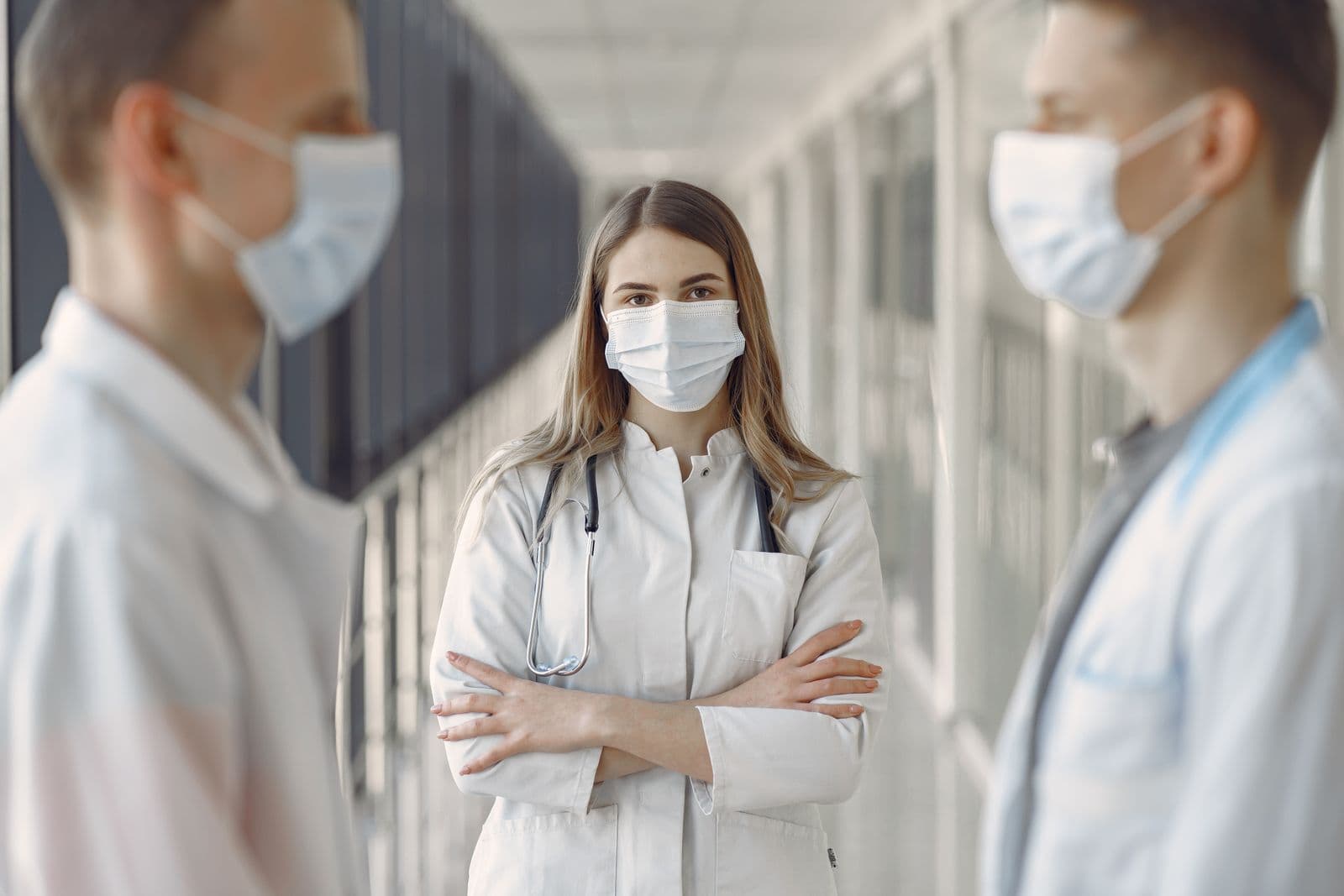 Medical professionals in a clinic corridor